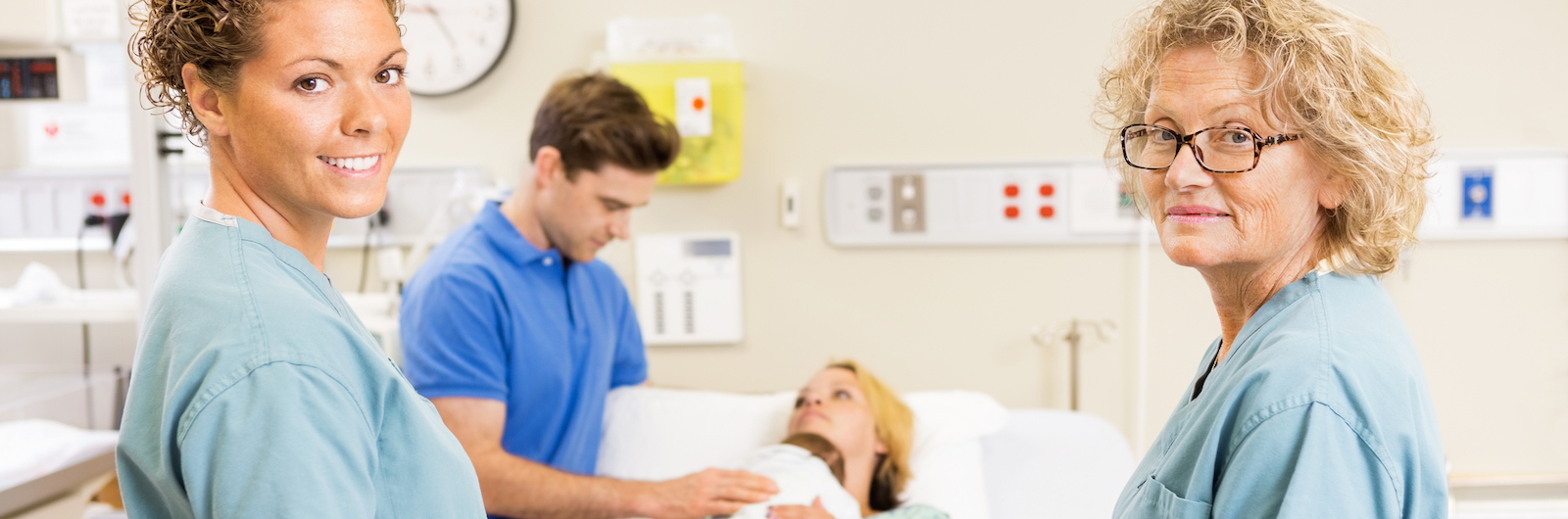 Midwives with mother and newborn